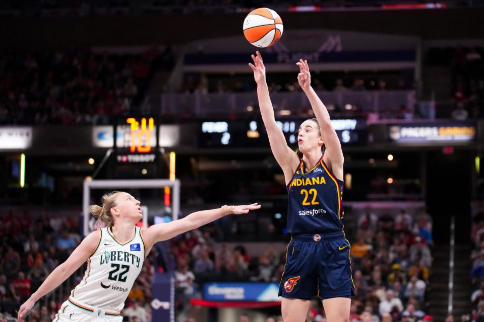 Indiana Fever guard Caitlin Clark (22) shoots a 3-pointer against the New York Liberty.