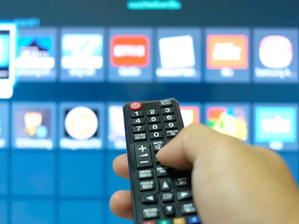 Canadian media companies are entering the FAST industry with platforms and channels that essentially allow viewers to stream content for free. But as with traditional cable channels, they have periodic ad breaks in between scheduled programming that runs 24/7.  (Kowit Khamanek/Shutterstock - image credit)