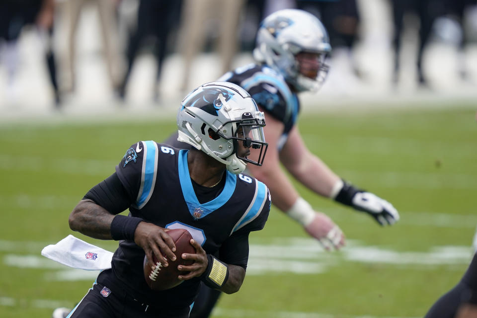 Carolina Panthers quarterback P.J. Walker looks tp pass during the first half of an NFL football game against the Detroit Lions Sunday, Nov. 22, 2020, in Charlotte, N.C. (AP Photo/Gerry Broome)