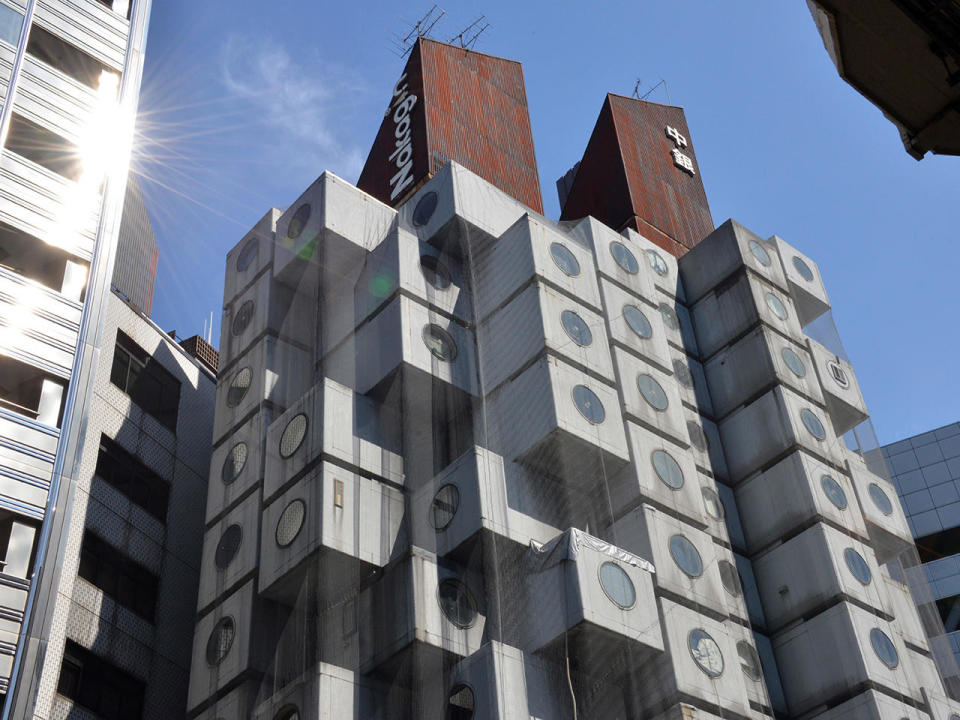 A 2014 file photo of the Nakagin Capsule Tower in Tokyo, comprised of 140 modular apartments and office spaces.  / Credit: YOSHIKAZU TSUNO/AFP via Getty Images