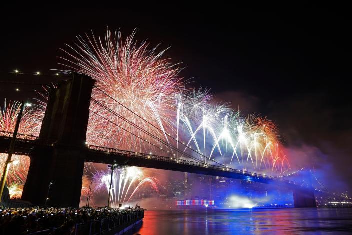 Fireworks light up the sky above the Brooklyn Bridge during the 2019 Macy's Fourth of July fireworks show in New York.