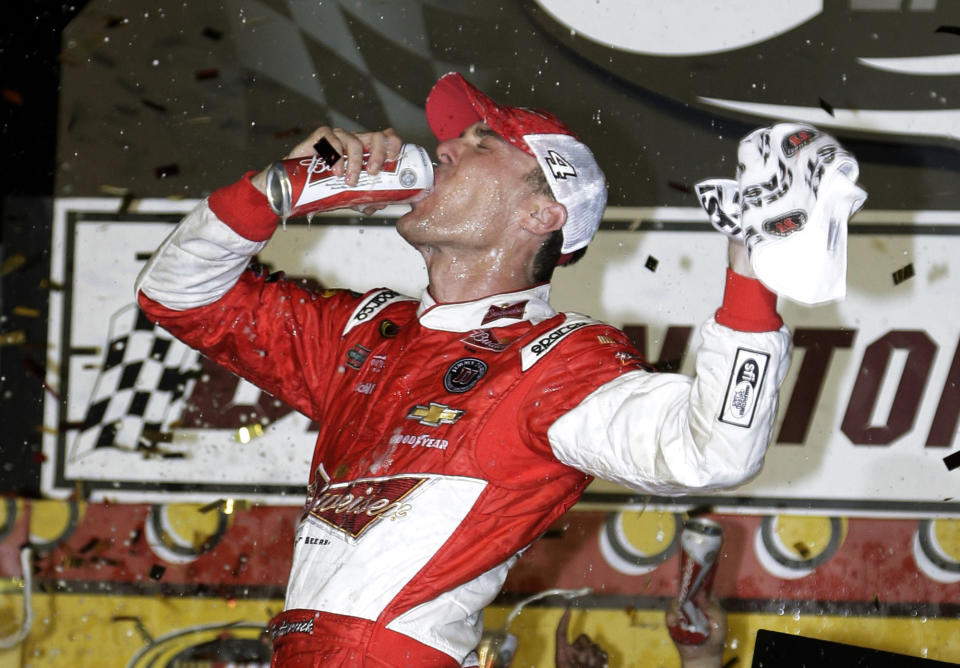 Kevin Harvick celebrates in Victory Lane after winning the NASCAR Sprint Cup series auto race at Darlington Raceway in Darlington, S.C., Saturday, April 12, 2014. (AP Photo/Chuck Burton)