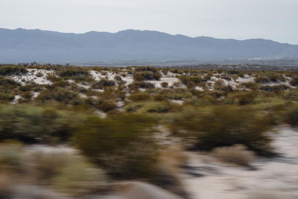 The open desert looking south towards Mexico along I-10 east outside of Fort Hancock, Texas. The Padilla family has to drive over an hour to El Paso from Fort Hancock for all their healthcare appointments. Fort Hancock, Texas on November 28, 2023.