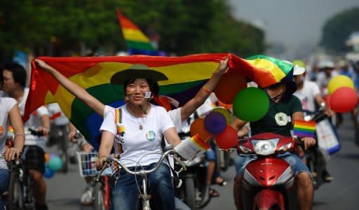 The first gay pride parade in communist Vietnam took place in the capital Hanoi with dozens of cyclists displaying balloons and rainbow flags streaming through the city's streets