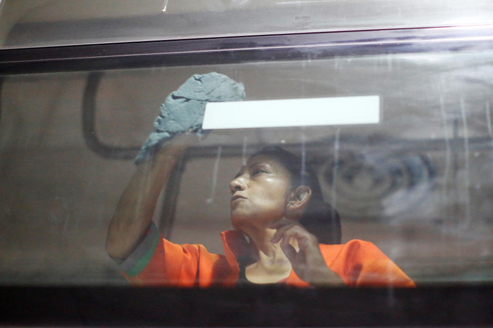 A worker cleans the windows of a metro car before a disinfection, as part of Mexico City's government's measures in response to the coronavirus disease (COVID-19), in Mexico City