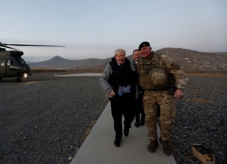 Britain's Foreign Secretary Boris Johnson (L) and Brigadier Ian Rigden, (R) Chief mentor At Afghan National Army Officer Academy arrives during his visits at Camp Qargha in Kabul, Afghanistan November 26, 2016. REUTERS/Mohammad Ismail