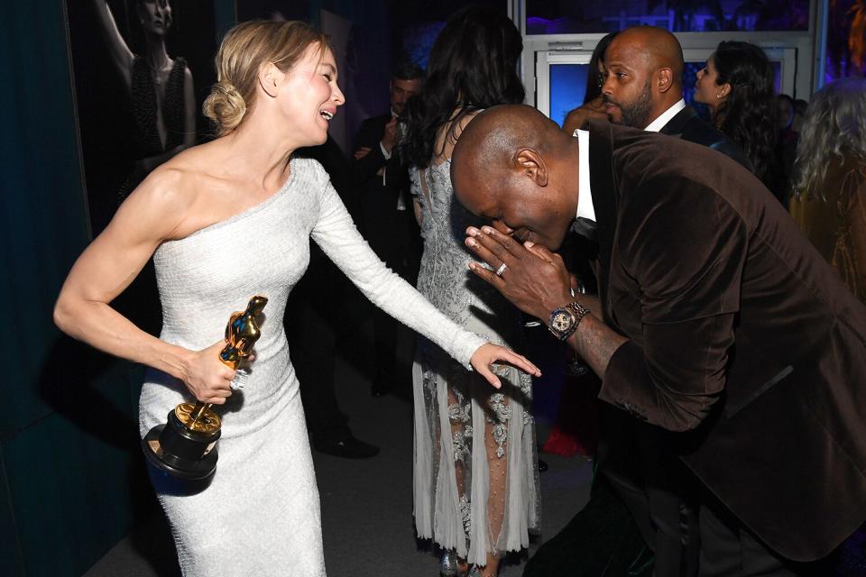 <em>Fast & Furious</em> actor Tyrese Gibson bows to Renée Zellweger (and her Oscar for Best Actress) at the 2020 Vanity Fair Oscar Party.