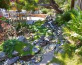 <p> Whether you go for a gently meandering waterfall or an elegant backyard pond, these features will undoubtedly bring soothing, sensory benefits to your plot. </p> <p> They don't have to cost a ton either, especially if you build them yourself. If you've got the space, you can dig them straight into the ground and add a liner. Use plenty of pebbles and plants on either side for an organic feel. </p> <p> Alternatively, if space is at a premium, you can create a smaller display with a large container. Add a pump and you can enjoy the trickling sounds too as you relax nearby. </p>