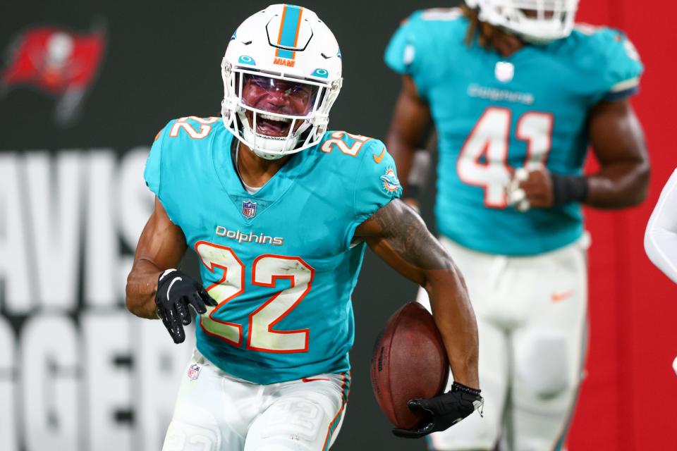 Miami Dolphins safety Elijah Campbell reacts after intercepting the ball against the Tampa Bay Buccaneers. [NATHAN RAY SEEBECK/USA TODAY Sports]