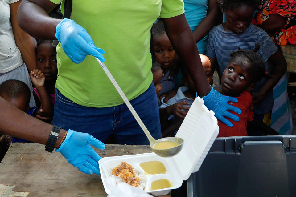 humanitarian food aid help hunger youth (Odelyn Joseph / AP)