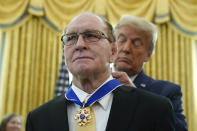 President Donald Trump awards the Presidential Medal of Freedom, the highest civilian honor, to Olympic gold medalist and former University of Iowa wrestling coach Dan Gable in the Oval Office of the White House, Monday, Dec. 7, 2020, in Washington. (AP Photo/Patrick Semansky)
