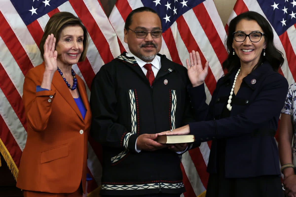 Gene Peltola, centre, participates in the swearing-in of his wife, Congresswoman Mary Peltola, in January. (Getty Images)
