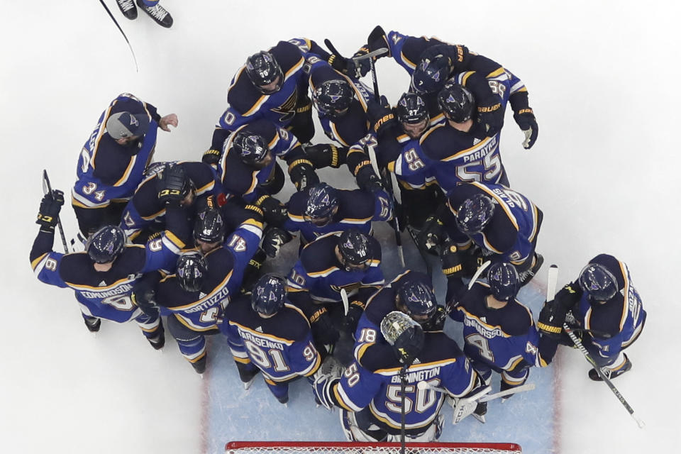 FILE - In this Tuesday, May 21, 2019 file photo, the St. Louis Blues celebrate after beating the San Jose Sharks in Game 6 of the NHL hockey Stanley Cup Western Conference final series, in St. Louis. The Blues won 5-1 to win the series 4-2 and earn a berth in the Stanley Cup Finals. (AP Photo/Jeff Roberson)