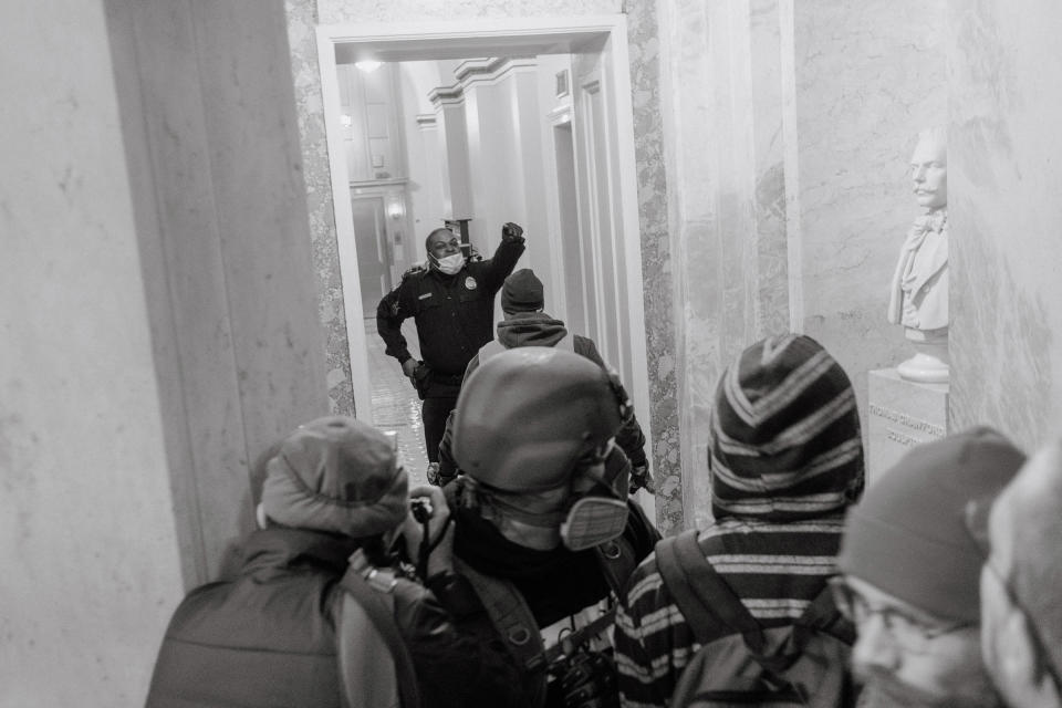 A Capitol Police officer is pushed back as he attempts to stop pro-Trump rioters from entering further into the Capitol building.<span class="copyright">Christopher Lee for TIME</span>