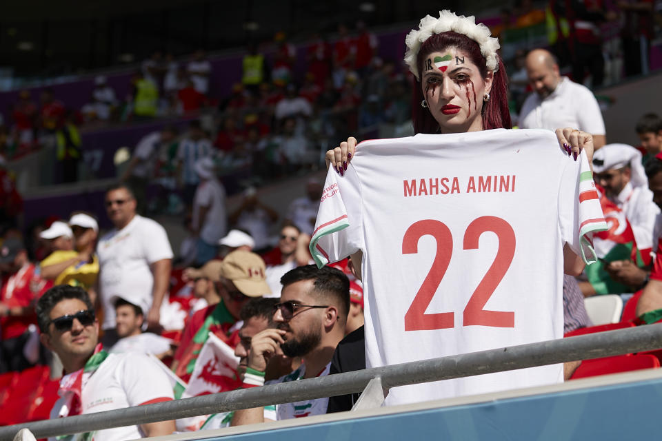 DOHA, QATAR - NOVEMBER 25:  A Fan of Iran protest for Womens freedom and pay tribute to Mahsa AMINI prior to the FIFA World Cup Qatar 2022 Group B match between Wales and IR Iran at Ahmad Bin Ali Stadium on November 25, 2022 in Doha, Qatar. (Photo by Juan Luis Diaz/Quality Sport Images/Getty Images)