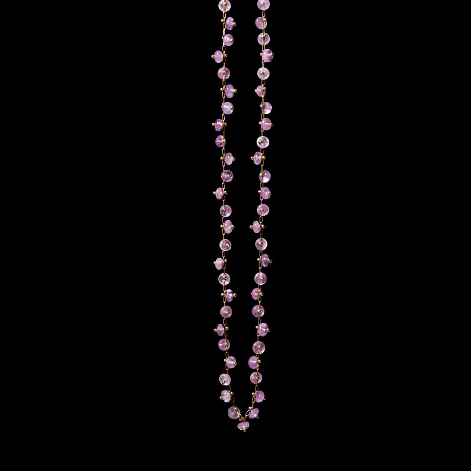 TenThousandThings’ signature beaded pink sapphire beads on a gold chain.