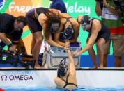 2016 Rio Olympics - Swimming - Final - Women's 4 x 200m Freestyle Relay Final - Olympic Aquatics Stadium - Rio de Janeiro, Brazil - 10/08/2016. Team USA Katie Ledecky (USA) of USA, Maya DiRado (USA) of USA, Leah Smith (USA) of USA and Allison Schmitt (USA) of USA celebrate winning the gold medal. REUTERS/David Gray