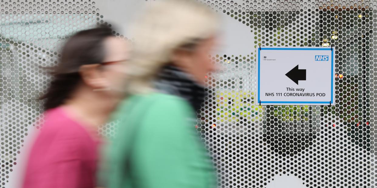 A sign directs directs patients to an NHS 111 Coronavirus Pod testing service area for COVID-19 assessment at University College Hospital in London on March 5, 2020.ISABEL INFANTES:AFP via Getty Images)