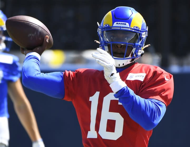 Los Angeles Rams quarterback Bryce Perkins throws a pass during NFL football training camp Friday, Aug 6, 2021, in Irvine, Calif. (AP Photo/John McCoy)