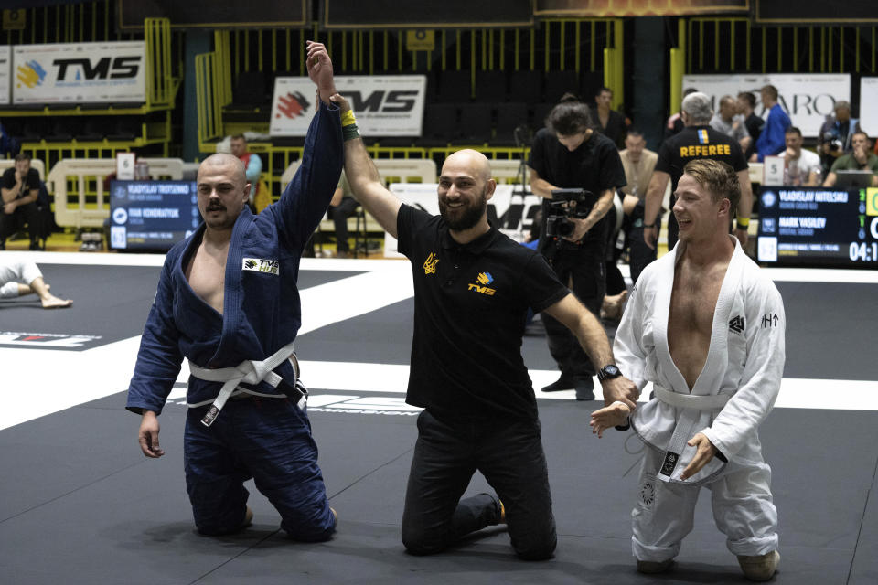 Ukrainian war veterans with amputated limbs perform at the Ukrainian national competition of jiu jitsu in Kyiv, Ukraine, Sunday, Oct. 29, 2023. More than 20,000 people in the Ukraine have lost limbs from injuries since the start of the Russian war, many of them soldiers. Some of them have learned to deal with their psychological trauma by practicing a form of Brazilian jiu-jitsu. (AP Photo/Roman Hrytsyna)