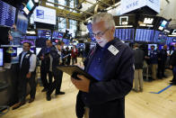 Trader Frank O'Connell works on the floor of the New York Stock Exchange, Friday, Aug. 16, 2019. Stocks are opening broadly higher at the end of a turbulent week. (AP Photo/Richard Drew)