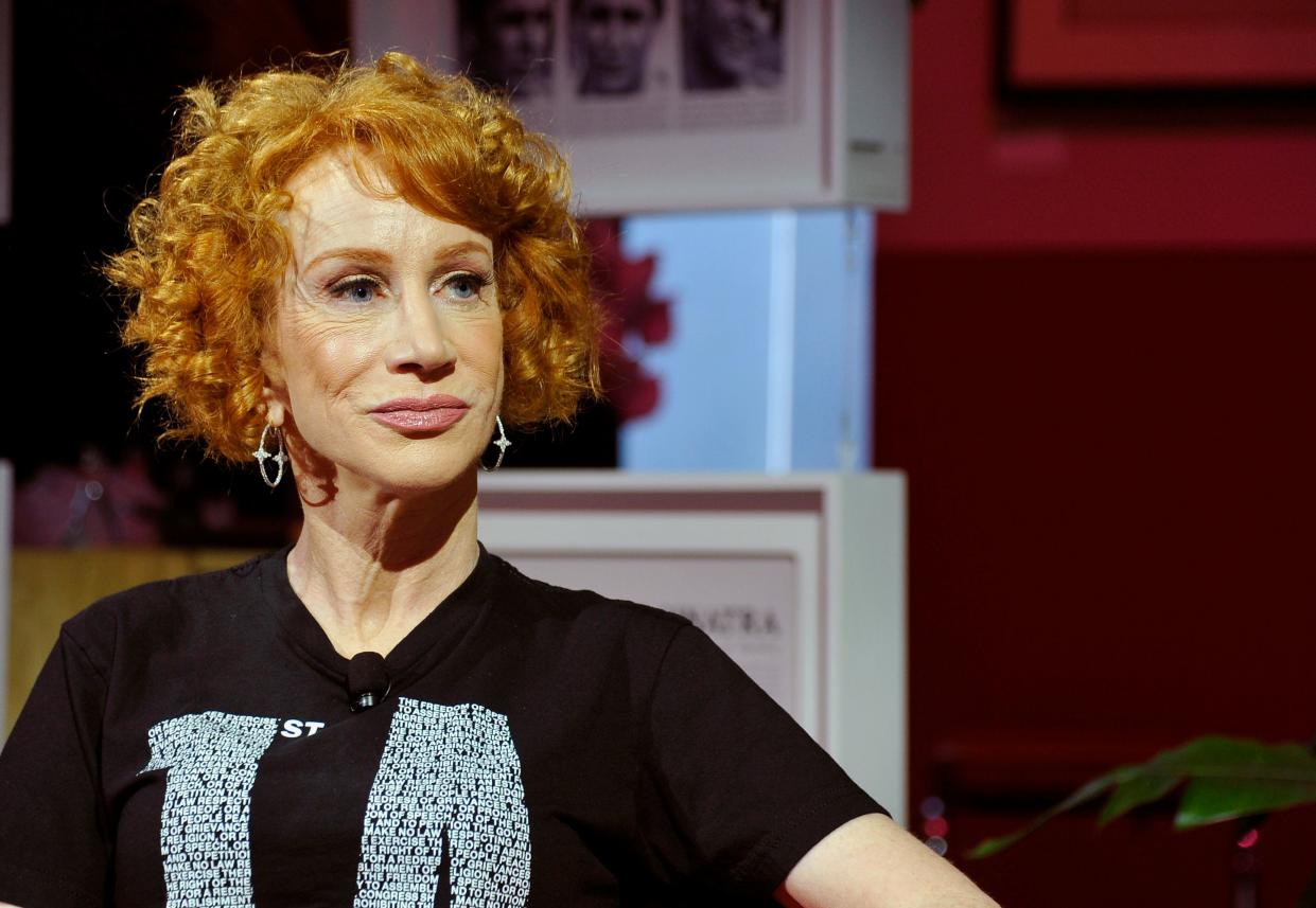 Kathy Griffin looks to the right of the camera wearing a black T-shirt