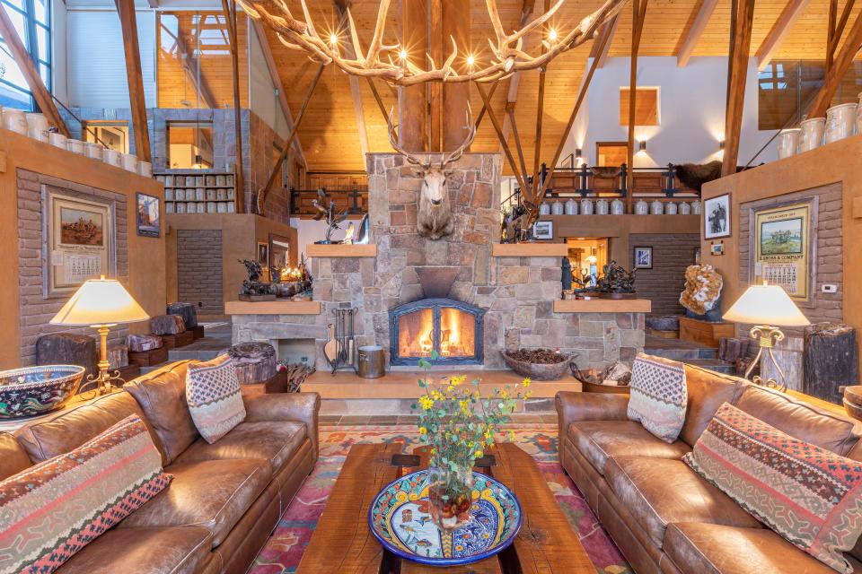 The centerpiece of the great room is the massive stone fireplace.