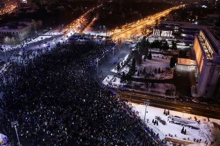 People take part in a demonstration to protest against government plans to reform some criminal laws through emergency decree, in front of the government headquarters Victoria Palace in Bucharest, Romania, January 29, 2017. Inquam Photos/Octav Ganea via REUTERS