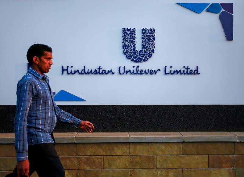 FILE PHOTO: File picture of a pedestrian walking past the Hindustan Unilever Limited headquarters