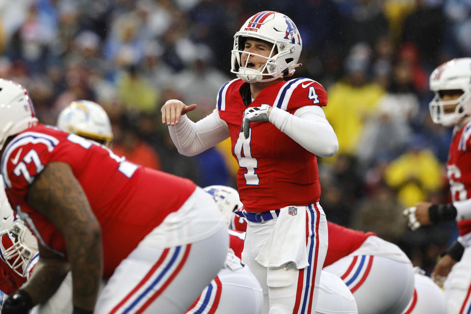 New England Patriots quarterback Bailey Zappe (4) calls a play on the line of scrimmage during the first half of an NFL football game against the Los Angeles Chargers, Sunday, Dec. 3, 2023, in Foxborough, Mass. (AP Photo/Michael Dwyer)