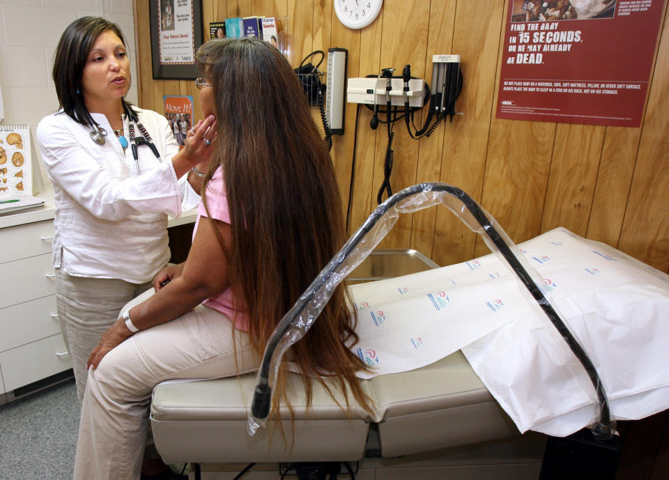 Dr. LeeAnna Muzquiz of Ronan Tribal Health examines Mary Parker during a checkup in Ronan, Montana. (Photo: ASSOCIATED PRESS)