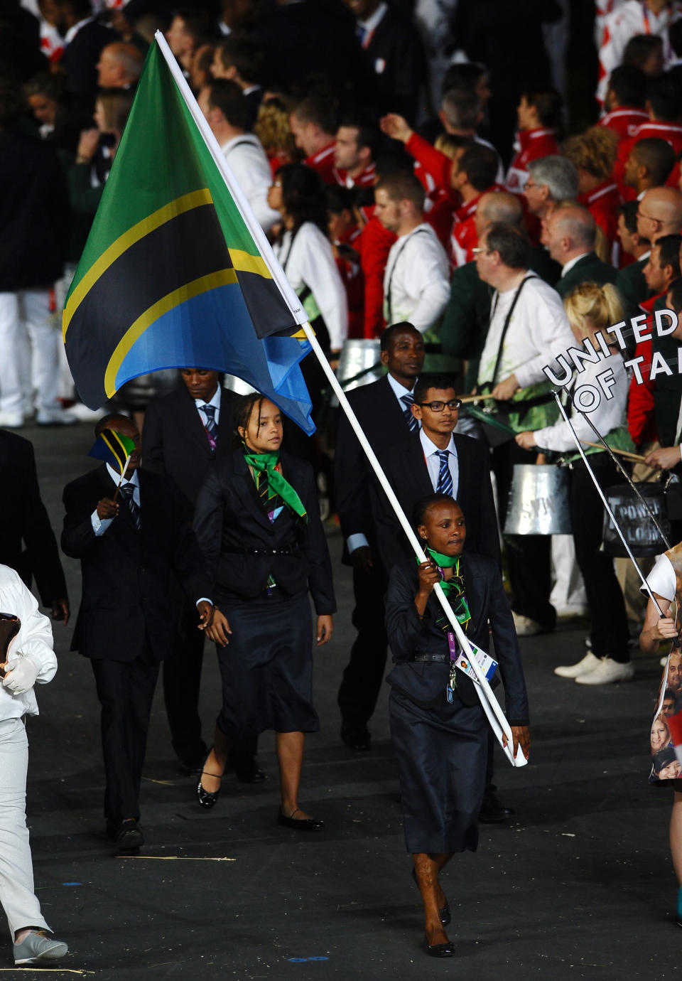 LONDON, ENGLAND - JULY 27: Zakia Mrisho of the United Republic of Tanzania Olympic team carries her country's flag during the Opening Ceremony of the London 2012 Olympic Games at the Olympic Stadium on July 27, 2012 in London, England. (Photo by Laurence Griffiths/Getty Images)