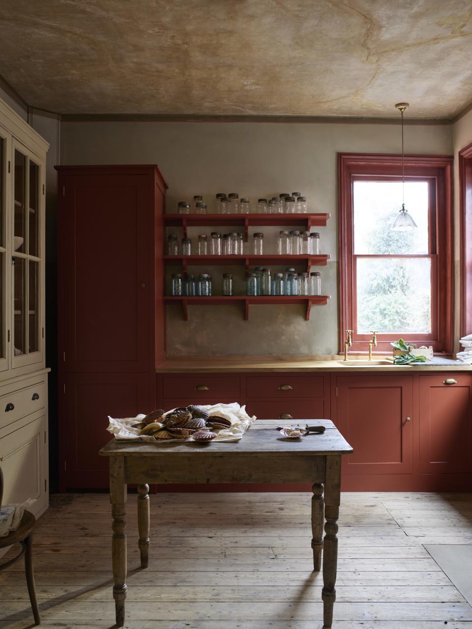 Choose a rusty brick red for a traditional kitchen