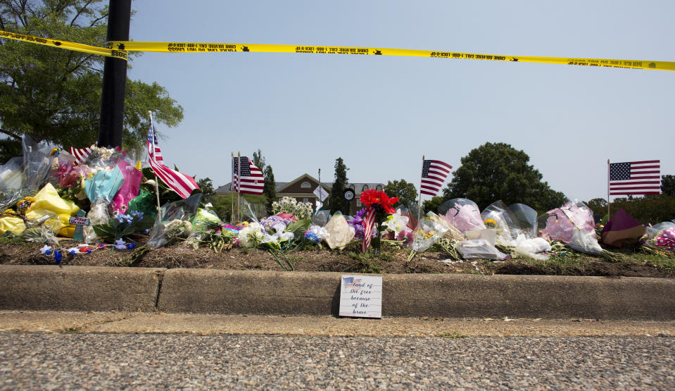 FILE - This June 3, 2019 file photo shows the memorial site honoring victims of a mass shooting that took place on May 31, 2019 at the Virginia Beach Municipal Center in Virginia Beach, Va. A state commission tasked with investigating the 2019 mass shooting in Virginia Beach has called for numerous changes to how Virginia and its communities respond to mass shootings. (L. Todd Spencer/The Virginian-Pilot via AP, File)