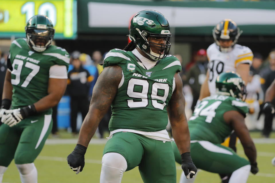 FILE - In this Dec. 22, 2019, file photo, New York Jets nose tackle Steve McLendon (99) celebrates in the second half of an NFL football game against the Pittsburgh Steelers, in East Rutherford, N.J. A person with direct knowledge of the move says the New York Jets have agreed to terms on a trade that sends veteran nose tackle Steve McLendon to the Tampa Bay Buccaneers. The deal that was agreed upon Sunday night, Oct. 18, 2020, will reunite McLendon with Buccaneers defensive coordinator Todd Bowles, who was the Jets' head coach from 2015-18. (AP Photo/Seth Wenig, File)