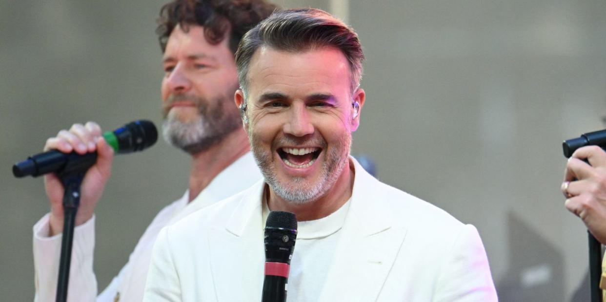 gary barlow performs with take that