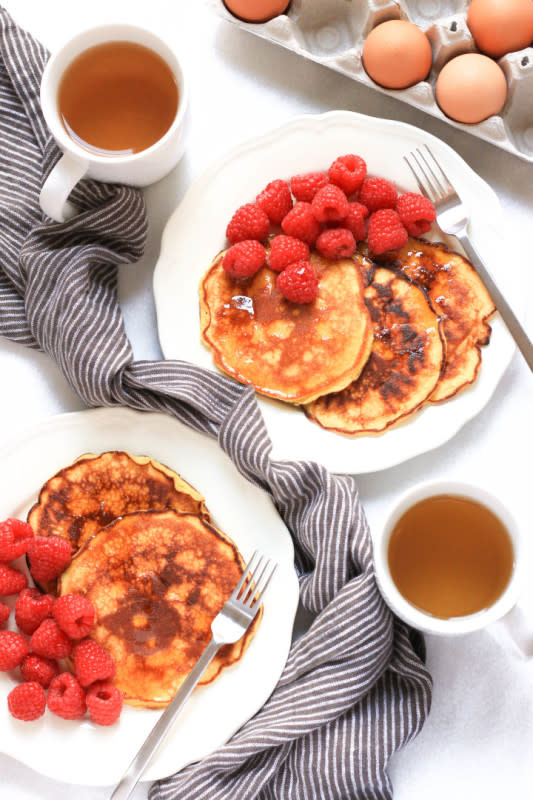 <p>Grain-free, fluffy pancakes made with coconut flour, served with a generous portion of fresh fruit and maple syrup. So. Crazy. Good.</p><p><a href="http://dishbydish.net/2016/02/22/grain-free-coconut-flour-pancakes/" rel="nofollow noopener" target="_blank" data-ylk="slk:Get the recipe here!;elm:context_link;itc:0;sec:content-canvas" class="link rapid-noclick-resp"><em><strong>Get the recipe here!</strong></em></a></p>