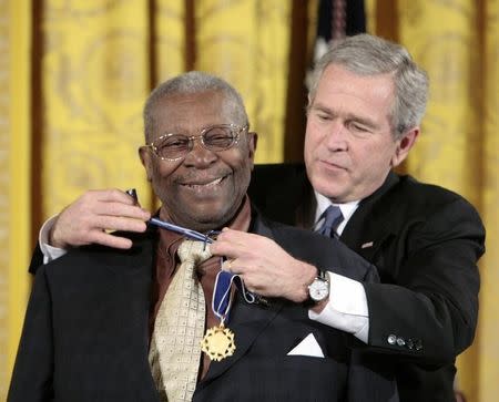 U.S. President George W. Bush (R) honors musician BB King as one of the 2006 recipients of the Presidential Medal of Freedom in the East Room of the White House in Washington December 15, 2006. The Presidential Medal of Freedom is the U.S.'s highest civil award. REUTERS/Larry Downing/Files