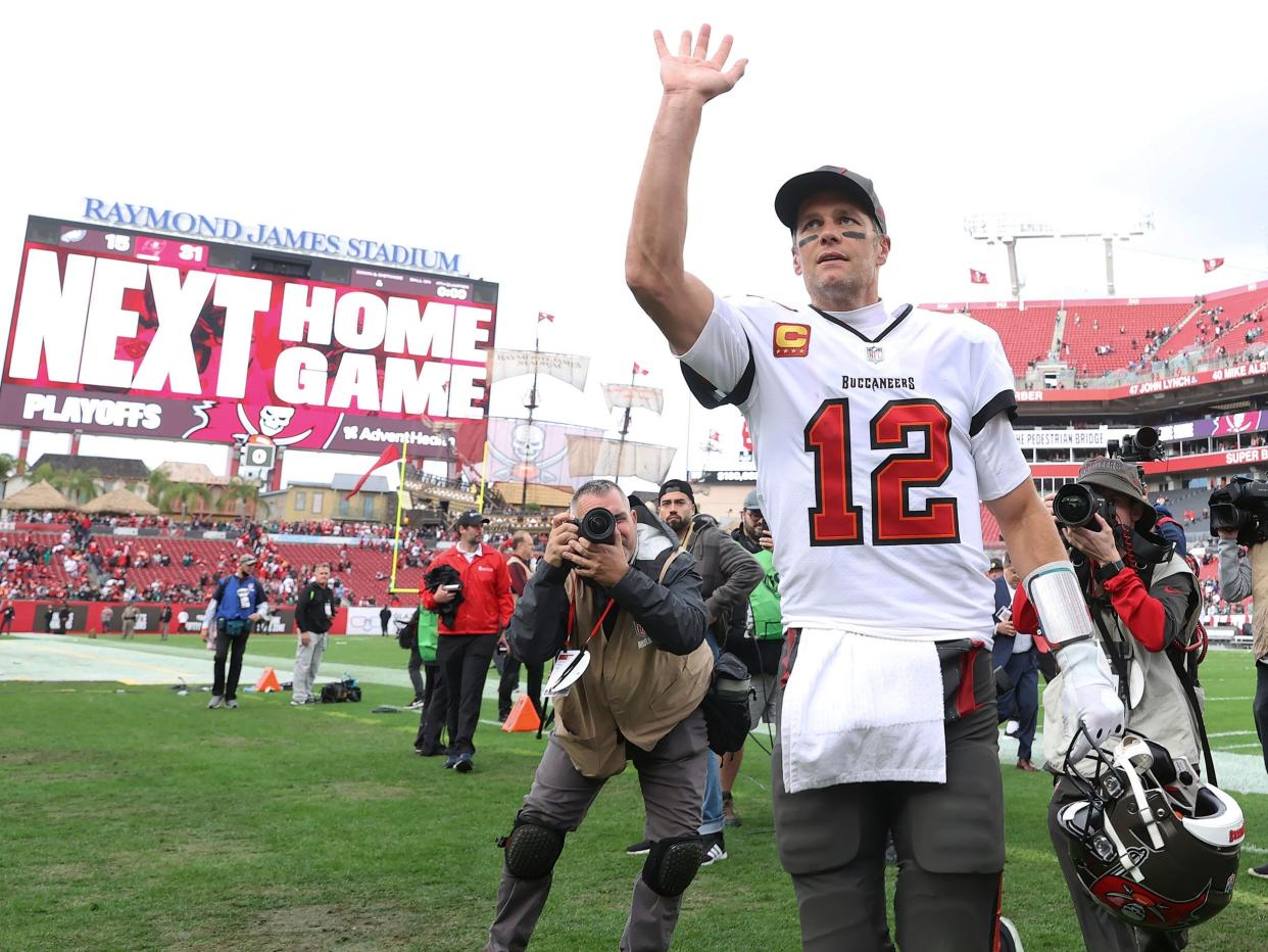 Tom Brady walks off the field after a game.