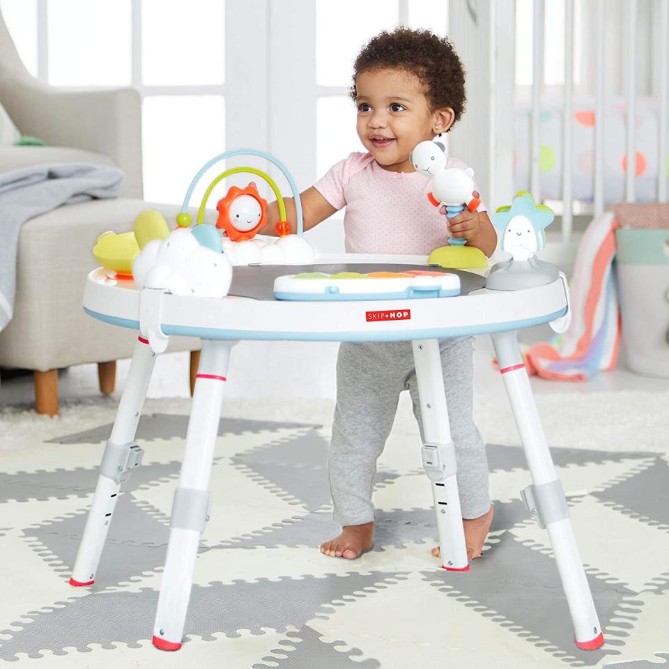 This "hub" will keep your little one entertained, thanks to 25+ developmental activities and cute movable toys, like peekaboo clouds and swaying stars, all of which they'll love to play with. <br /><br /><strong>Promising review:</strong> "We refer to this contraption as 'the office' because it not only keeps our little guy busy (there are 25+ developmental activities crammed into this thing) but he looks like a boss as he swivels around in his 360-degree rotating seat. <strong>It's sturdy and boy does it taking a beating (especially that bouncy sheep). The beats from the piano aren't bad either.</strong> The best part about the Skip Hop 3-Stage Interactive Activity Center might be it's bright but not loud color palette that won't completely clash with the rest of your furniture." &mdash; <a href="https://www.buzzfeed.com/jmihaly" target="_blank" rel="noopener noreferrer">John Mihaly</a><br /><br /><a href="https://amzn.to/3oPnqcs" target="_blank" rel="noopener noreferrer"><strong>Get it from Amazon for $135.99.﻿</strong></a>