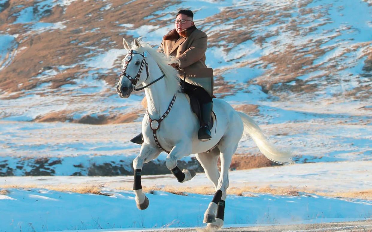 In heroic mode, Kim Jong-un rides a white horse to climb Mount Paektu near the border with China - KCNA via KNS