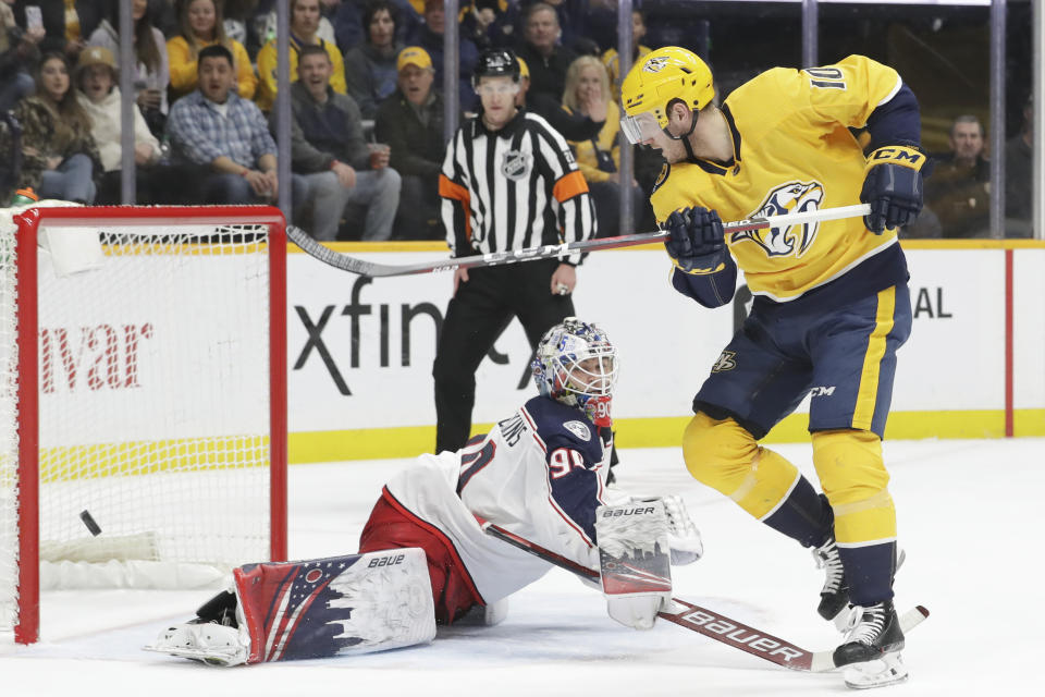 Columbus Blue Jackets goaltender Elvis Merzlikins (90) blocks a shot by Nashville Predators center Colton Sissons (10) in the second period of an NHL hockey game Saturday, Feb. 22, 2020, in Nashville, Tenn. (AP Photo/Mark Humphrey)