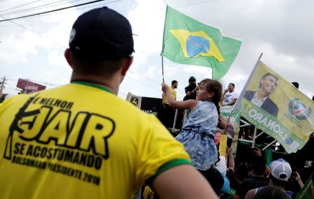 Supporters of presidential candidate Jair Bolsonaro attend a rally for vice presidential candidate, Hamilton Mourao, in Manaus, Amazonas state, Brazil September 15, 2018. REUTERS/Bruno Kelly/Files