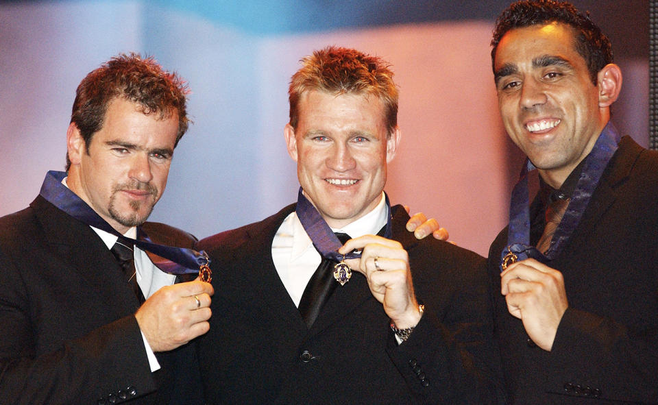 Mark Riccuito, Nathan Buckley and Adam Goodes, pictured here with their Brownlow Medals in 2003.