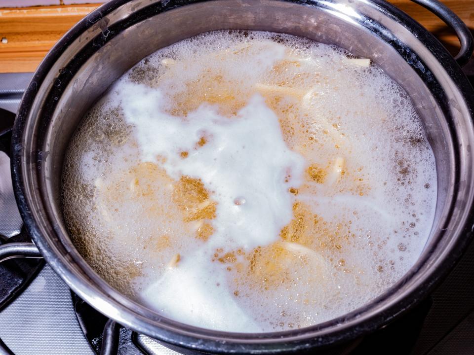 Boiling pot of water and pasta on stovetop