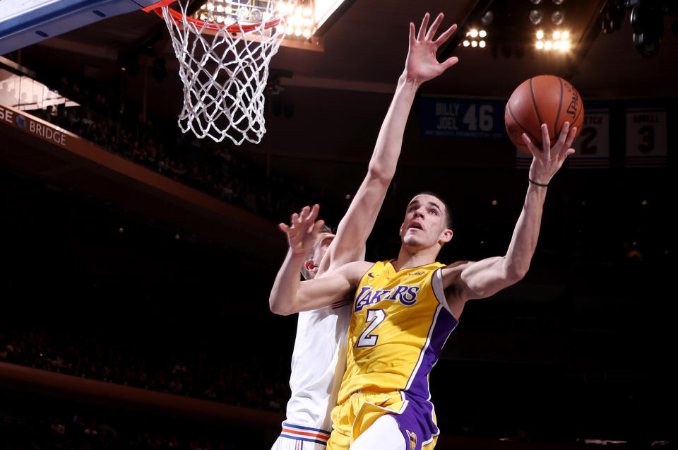 Lonzo Ball goes to the hole against the Knicks’ Kristaps Porzingis. (Getty Images)