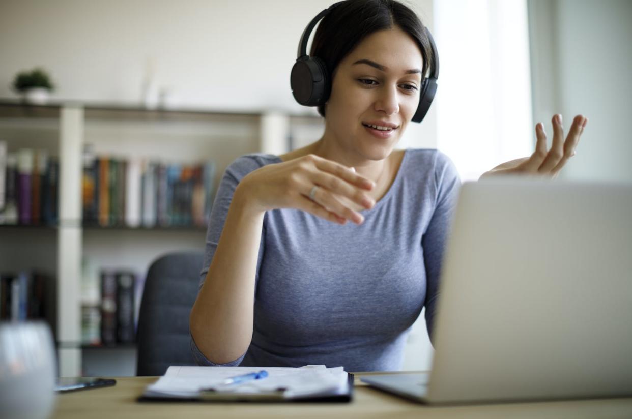 <span class="caption">The convenience of distance learning at for-profit colleges has contributed to their rising enrollment. </span> <span class="attribution"><a class="link " href="https://www.gettyimages.com/detail/photo/young-woman-having-video-call-on-laptop-computer-at-royalty-free-image/1221479489?adppopup=true" rel="nofollow noopener" target="_blank" data-ylk="slk:damircudic/E+ via Getty Images;elm:context_link;itc:0;sec:content-canvas">damircudic/E+ via Getty Images</a></span>