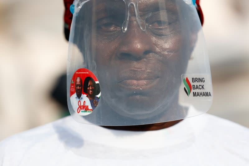 Supporter of the opposition National Democratic Congress partakes in an organized community health walk in Accra