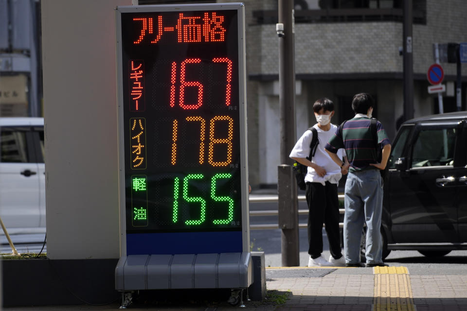 Gas prices are seen at a gas station Monday, April 25, 2022, in Tokyo. Russia's war in Ukraine has sent energy prices soaring, a big minus for resource-poor Japan, and the Japanese yen has nose-dived, trading at about 130 yen to the U.S. dollar. In trade, higher energy prices have inflated the price of imports, weakening the usual boost from exports, according to data. (AP Photo/Eugene Hoshiko)