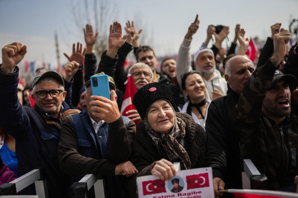 Supporters listen to Istanbul Mayor and Republican People's Party, or CHP, candidate for Istanbul Ekrem Imamoglu during a campaign rally, in Istanbul, Turkey, Tuesday, March 19, 2024. With local elections across Turkey days away, legal experts are coaching thousands of volunteer election monitors on the rules they'll need to watch for fraud and ensure a fair vote. (AP Photo/Francisco Seco)